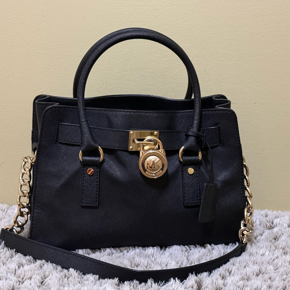 Michael Kors Hamilton leather satchel in black with gold-tone hardware.